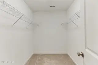 1316 N Fisher King Drive SE, Bolivia, NC 28422 — 3-bedroom home in Avalon, Bolivia, NC, photo 19 of 33: Primary Closet