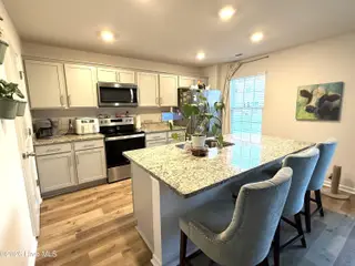 917 Riverstone Drive, Greenville, NC 27858 – photo 8: Island with sink and dining