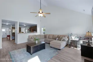 107 Peletier Shores Drive, Peletier, NC 28584 – photo 13: Living room with electric fireplace