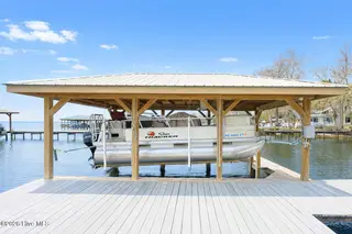 2908 Canal Cove Road, Lake Waccamaw, NC 28450 – photo 3: 2908 Canal Cove - Covered Boat Lift