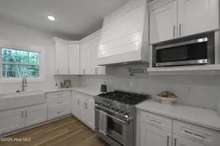 82 Northeast Drive NW, Calabash, NC 28467 – photo 11: 82NE Kitchen gas stove, pot filler & Far