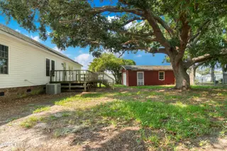 119 Dixon Drive, Newport, NC 28570 – photo 4: Fenced in backyard and detached garage