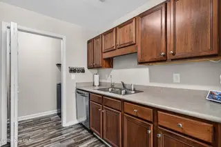 143 Ashbury Park Lane, Richlands, NC 28574 – photo 13: Kitchen and Laundry Peek