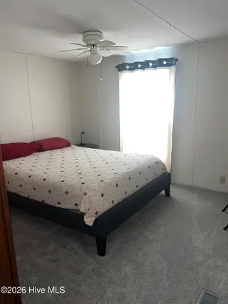 2773 Pirate Lane SW, Supply, NC 28462 — 3-bedroom manufactured home in Buccaneer Hills, Supply, NC, photo 18 of 47: 2773 Pirate Bedroom
