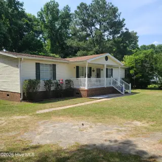 107 Eagle Ridge Drive, Dudley, NC 28333 — 4-bedroom manufactured home in Eagle Ridge, Dudley, NC, photo 2 of 17: Side