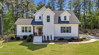 60 Cardinal Drive, Whispering Pines, NC 28327 – photo 1: 1_DJI_20260414151824_0049_D