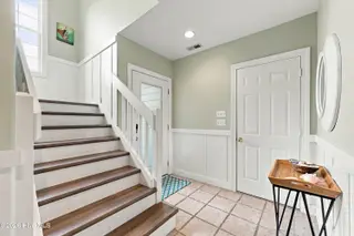 9936 Louise Howard Court East, Emerald Isle, NC 28594 — 3-bedroom townhome in Spinnakers Reach, Emerald Isle, NC, photo 10 of 32: Ground floor foyer