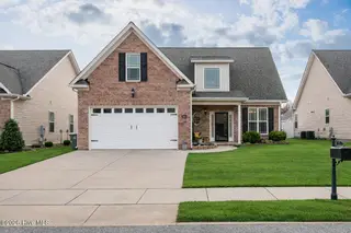 921 Dearborn Court, Winterville, NC 28590 – photo 5: Suburban home with lush lawn