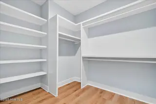 137 NE 3rd Street, Oak Island, NC 28465 – photo 16: Owners Retreat Closet
