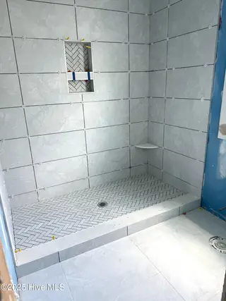 128 W Dolphin Drive, Oak Island, NC 28465 – photo 6: All showers tiled