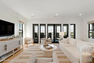 216 Radio Island Road, Morehead City, NC 28557 — 4-bedroom home in Tide Lines, Morehead City, NC, photo 6 of 56: Living Room w/ Floor-to-Ceiling Views