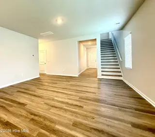 1087 Hanson Drive, Leland, NC 28451 – photo 15: Great Room Stair Access to Upstairs