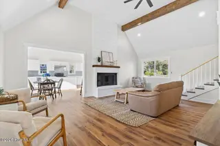 501 Shoreline Drive E, Sunset Beach, NC 28468 – photo 5: Living room opens to kitchen