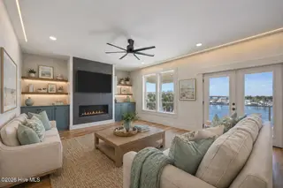 208 Radio Island Road, Morehead City, NC 28557 — 4-bedroom home in Tide Lines, Morehead City, NC, photo 18 of 62: living room vs fireplace sofas
