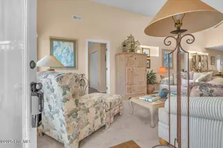 1708 W Beach Drive, Oak Island, NC 28465 – photo 3: 02-Final 1708 W Beach Dr OKI-RJREM-1796