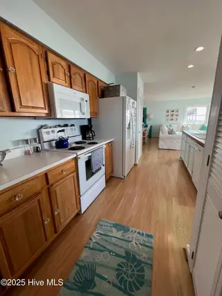801 Ocean Drive, Emerald Isle, NC 28594 – photo 14: 14 Kitchen with laundry closet and a
