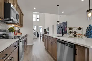 1218 Sunwater Terrace, Leland, NC 28451 — 4-bedroom townhome in Grand Park, Leland, NC, photo 13 of 49: Kitchen 3 - Hyacinth BE - Grand Park