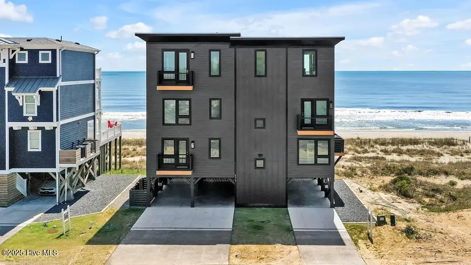 4213 W Beach Drive, Oak Island, NC 28465 – photo 1 of 44: Black Pearl 4