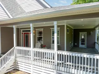 2790 Creek Bridge Court, Southport, NC 28461 — 3-bedroom home in St James, Southport, NC, photo 6 of 72: Trex Wrap Around Front Porch