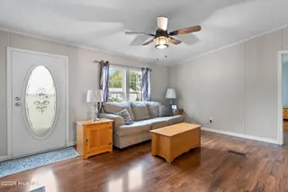 1109 Nautical Lane SW, Calabash, NC 28467 — 4-bedroom manufactured home in Village At Calabash, Calabash, NC, photo 6 of 34: Living room