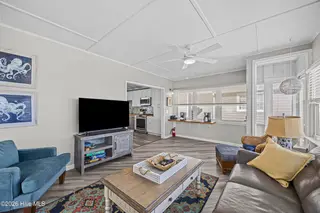 5127 W Beach Drive, Oak Island, NC 28465 – photo 19: 40_sun room