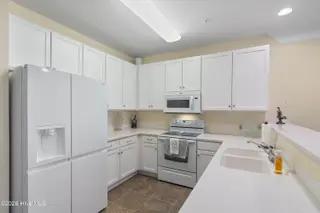 221 Woodlands Way Unit 21, Calabash, NC 28467 — 2-bedroom condo in Crow Creek, Calabash, NC, photo 12 of 39: Updated Fridge