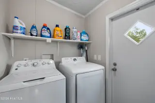 1109 Nautical Lane SW, Calabash, NC 28467 — 4-bedroom manufactured home in Village At Calabash, Calabash, NC, photo 11 of 34: Laundry