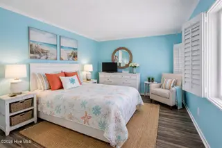 650 Salter Path Road 103, Pine Knoll Shores, NC 28512 – photo 16: AI furnished Bedroom png