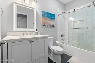 135 NW 7th Street, Oak Island, NC 28465 – photo 24: Bathroom 1