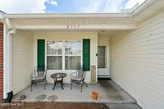 2947 Bay Village Street, Shallotte, NC 28470 — 3-bedroom home in Green Bay Village, Shallotte, NC, photo 5 of 33: Shady, perfect for porch sittin'