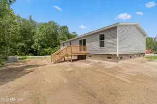 6777 Lewis Drive SE, Winnabow, NC 28479 – photo 3: Back yard -