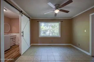 216 Plantation Drive, New Bern, NC 28562 – photo 22: Laundry room and 1/2 bath on first floor