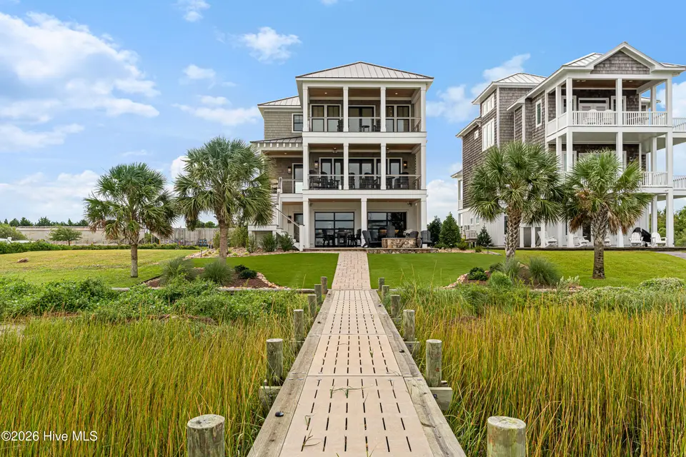216 Radio Island Road, Morehead City, NC 28557 — 4-bedroom home in Tide Lines, Morehead City, NC, photo 1 of 56: Waterfront Custom Home w/ Dock