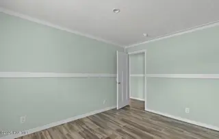 6823 Lewis Drive SE, Winnabow, NC 28479 – photo 21: Bedroom 3