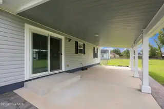 107 Fodder Drive, Hubert, NC 28539 — 3-bedroom home in Ole Mill Village, Hubert, NC, photo 8 of 59: 08_Covered_Patio