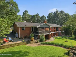 22 Pine Lake Drive, Whispering Pines, NC 28327 – photo 4: Terraced Backyard Leading to Pine Lake