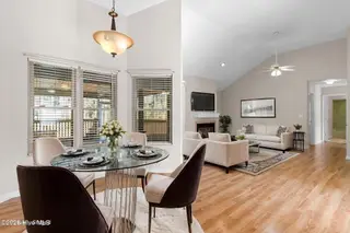71 Fairway Drive, Shallotte, NC 28470 – photo 11: Staged dining and living rooms