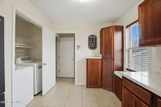 103 W Heron Court, Elizabeth Cty, NC 27909 – photo 15: 103 W Heron Kitchen end with laundry clo