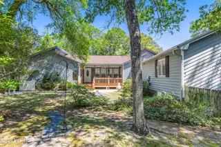2903 E Oak Island Drive, Oak Island, NC 28465 – photo 2: wooded yard