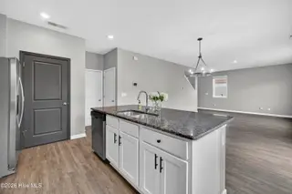 825 Seathwaite Lane SE, Leland, NC 28451 – photo 22: 825SeathwaiteLaneSE-16 Kitchen island vi