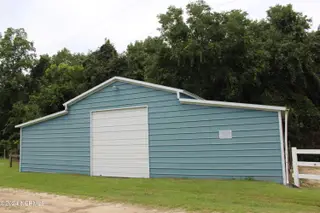 4507 Rivershore Drive, New Bern, NC 28560 – photo 10: Stable Barn with Tack area and pasture 2