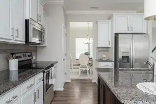 4010 Druids Glen Drive, Leland, NC 28451 – photo 11: Kitchen w/ Stainless Steel Appliances