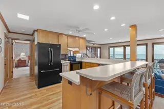 111 Dogwood Circle, Pine Knoll Shores, NC 28512 – photo 16: Kitchen with bar seating