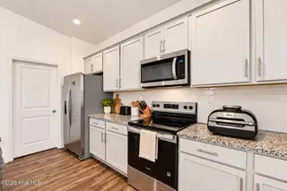 4136 Bertines Court, Elm City, NC 27822 — 3-bedroom home in River Stone, Elm City, NC, photo 10 of 39: Kitchen