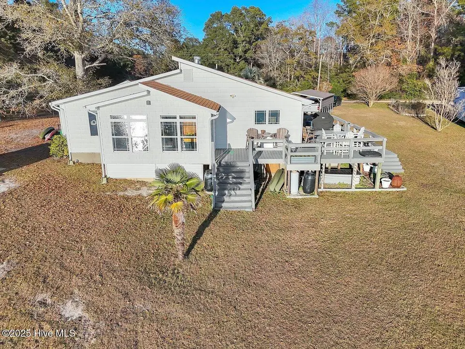 1229 Fletcher Hewett Road SW, Shallotte, NC 28470 — 2-bedroom home, Shallotte, NC, photo 1 of 52: Front/Side