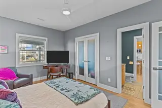 7403 E Beach Drive, Oak Island, NC 28465 – photo 19: Light-Filled Coastal Primary Suite