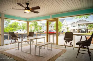 221 NE 58th Street, Oak Island, NC 28465 – photo 14: FRONT SCREENED IN PATIO