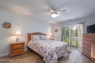 3350 Club Villas Drive 104, Southport, NC 28461 — 2-bedroom condo in St James, Southport, NC, photo 19 of 34: Spacious Primary Bedroom