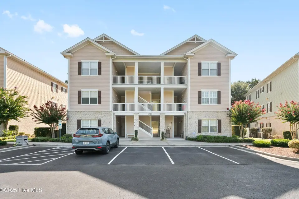 180 Clubhouse Road Apt 2, Sunset Beach, NC 28468 – photo 1 of 49: Front