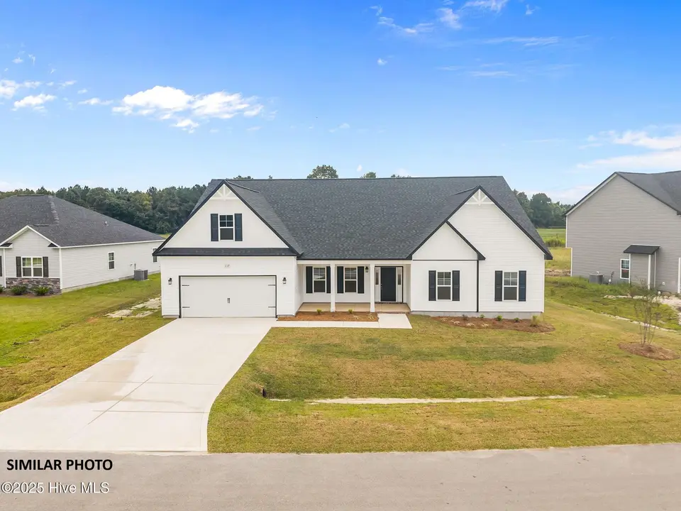1109 Lunenburg Place, Jacksonville, NC 28540 – photo 1 of 30: 1-web-or-mls-DJI_20250915133553_0744_D
